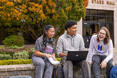Students sitting outside on a fall day. Links to Gifts of Cash, Checks, and Credit Cards cash.jpg